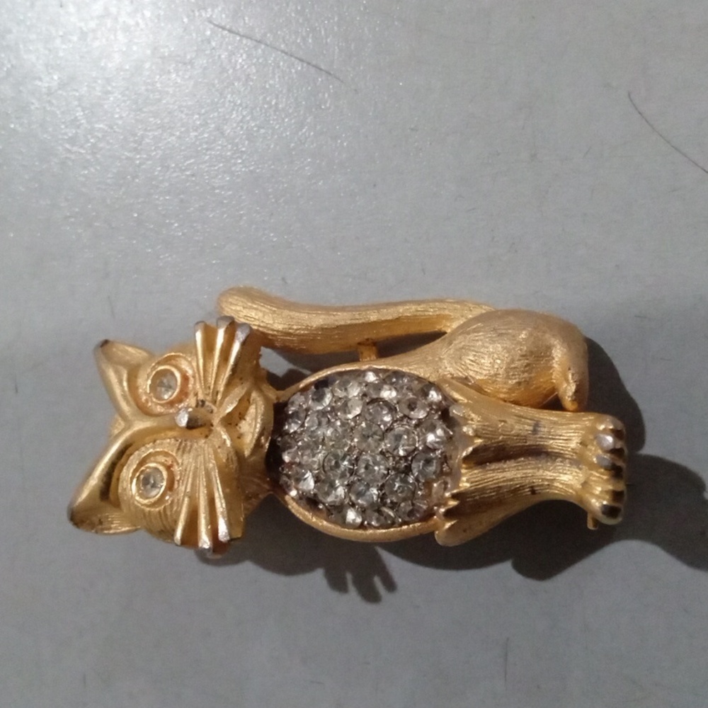 Vintage axiom Gold cat pin with clear rhinestones